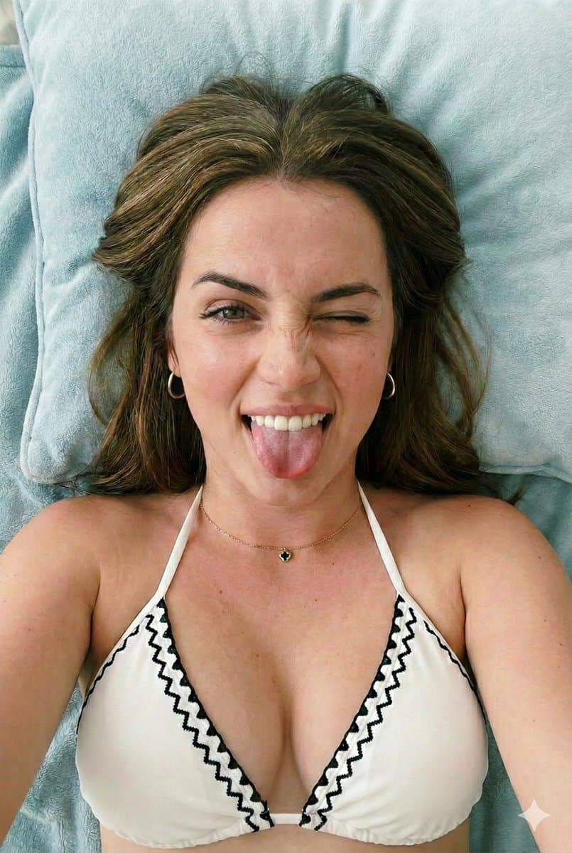 Close-up Portrait of a Playful Young Woman Lying Down — example 1