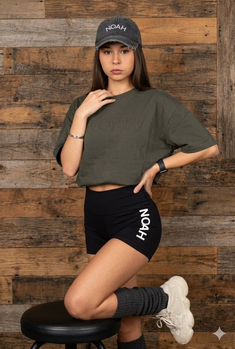 Latina Model in Distressed Denim and Wood Background — example 1