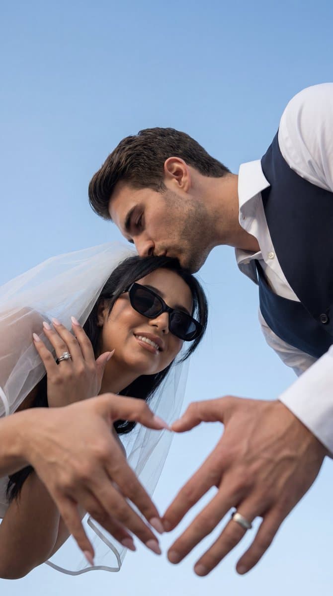 Low-Angle Wedding Editorial with Heart Hands — example 1